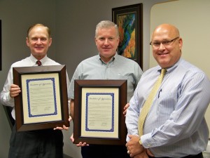 Terry Morgan and David Perkins receive Resolutions of Appreciation from Les Leach, Administrator for CHI St. Luke's Memorial Specialty Hospital for their service. Morgan has served on the Board for 9 years and Perkins has served 15 years. 